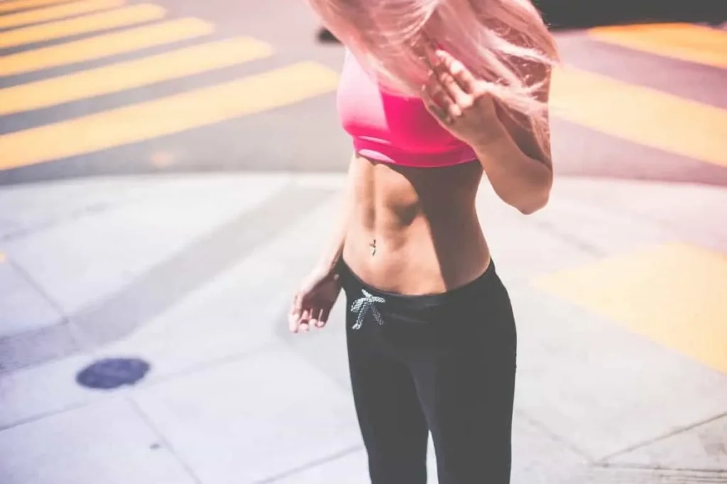 Woman with toned stomach after LA-EMS Body Sculpting Treatment Upton